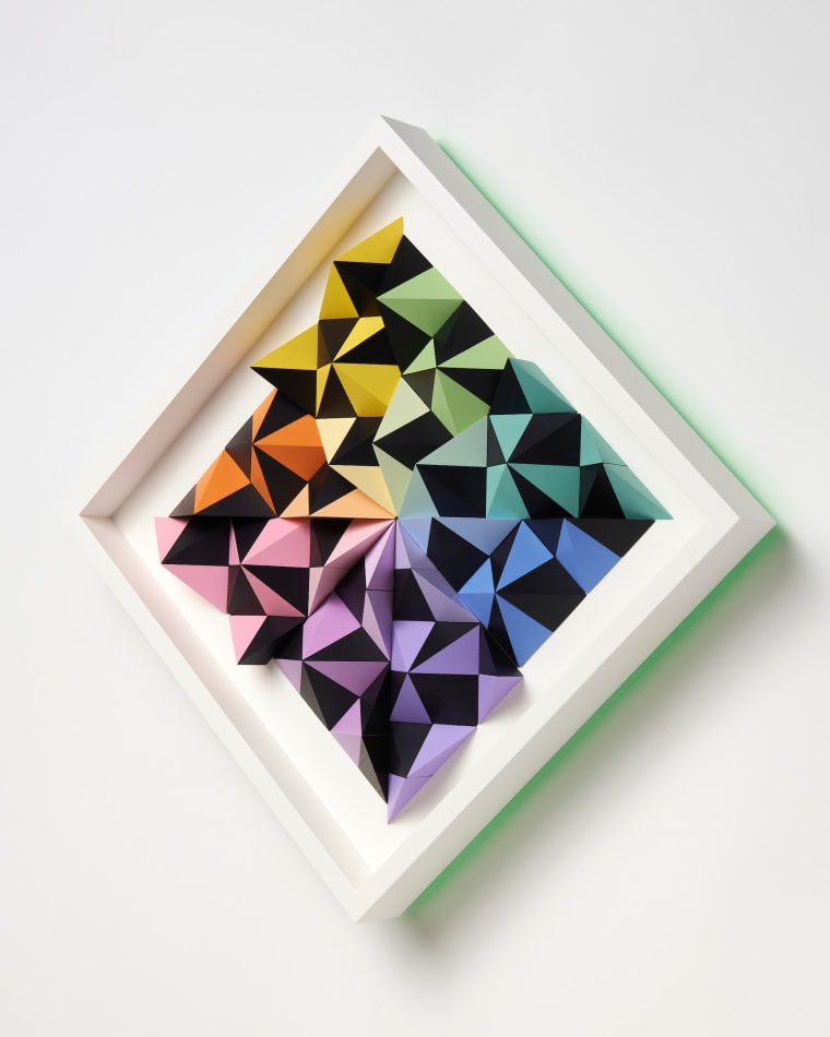 wooden wall sculpture with rainbow colors