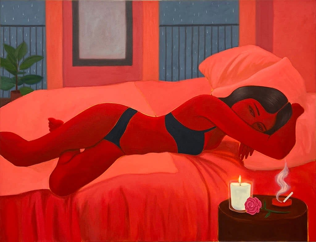 woman in her underwear laying in bed next to a lit candle