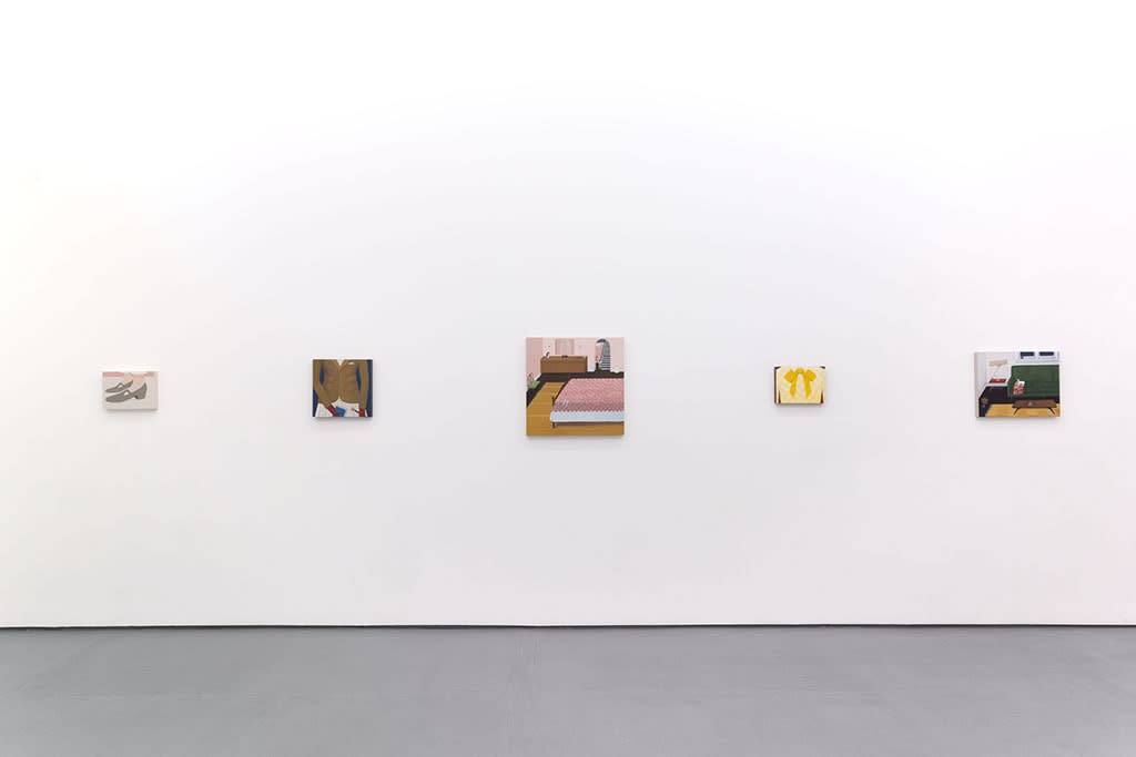 White gallery walls with paintings of various sizes by Angela Burson