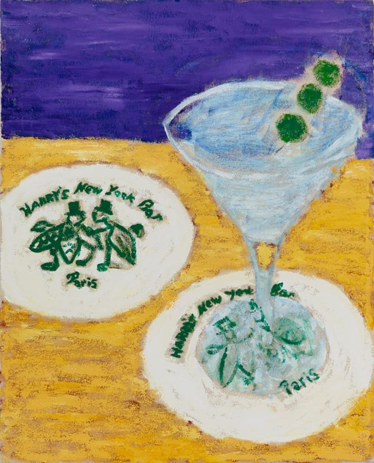 two coasters and a martini on a gold table with a purple background