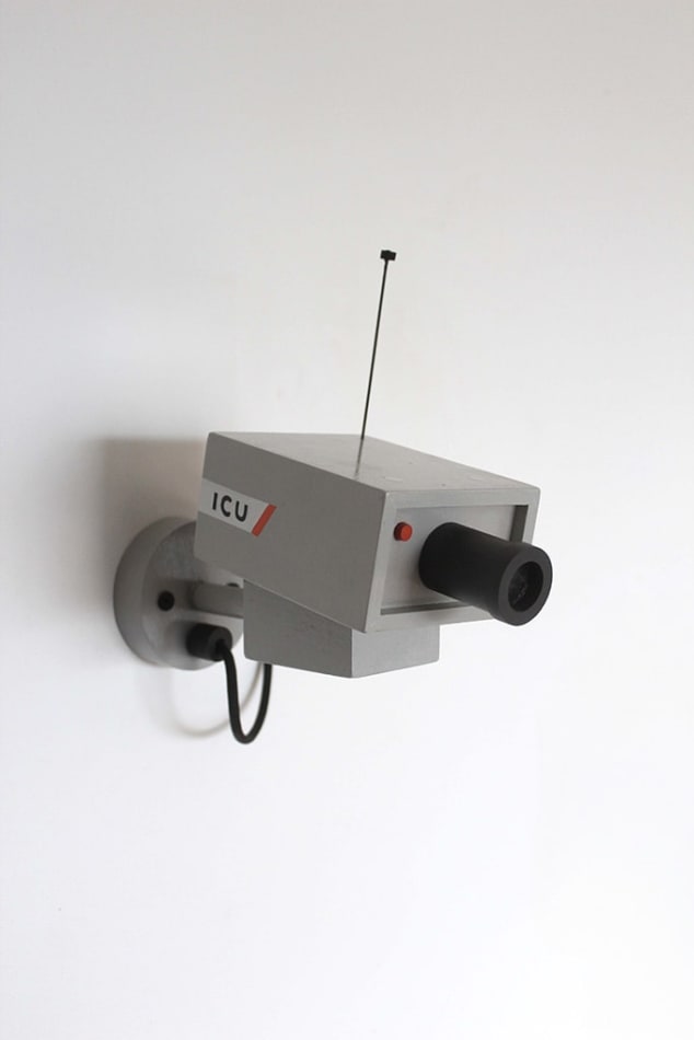 Sculpture of a gray CCTV camera by Jeff Canham