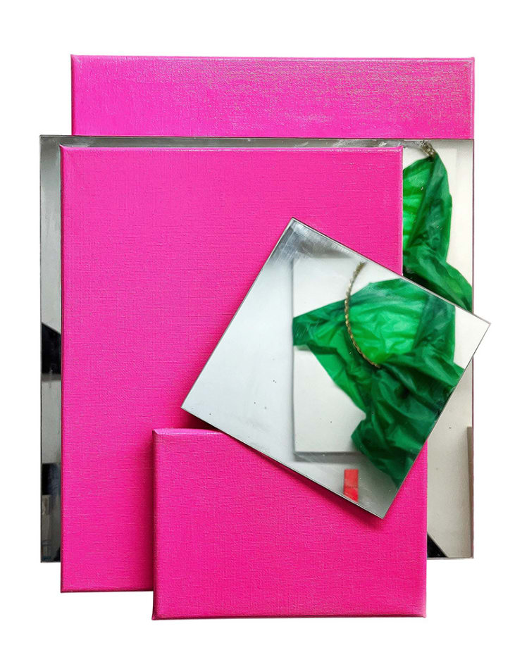 Pink painted canvases and mirror