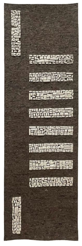 Long dark brown rectangular art work with smaller gray rectangles