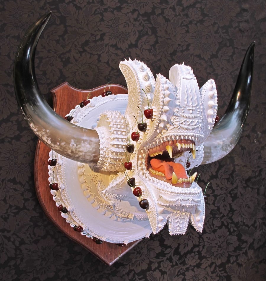 Scott Hove wall sculpture of monster bust decorated like cake