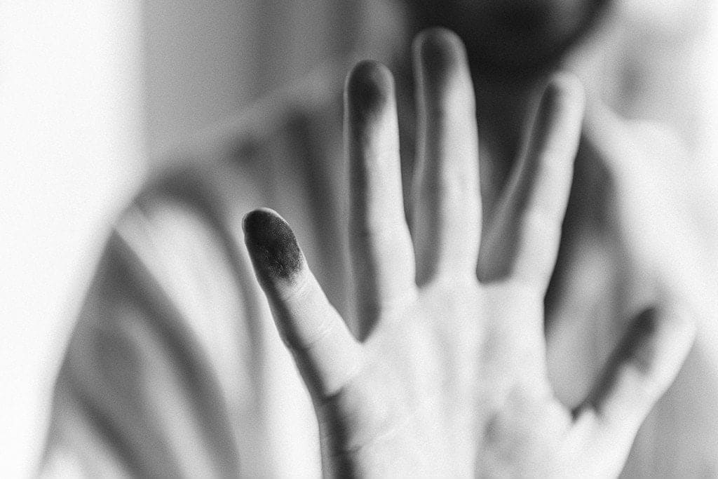 Shaun Roberts photo of charcoal stained fingers and hand