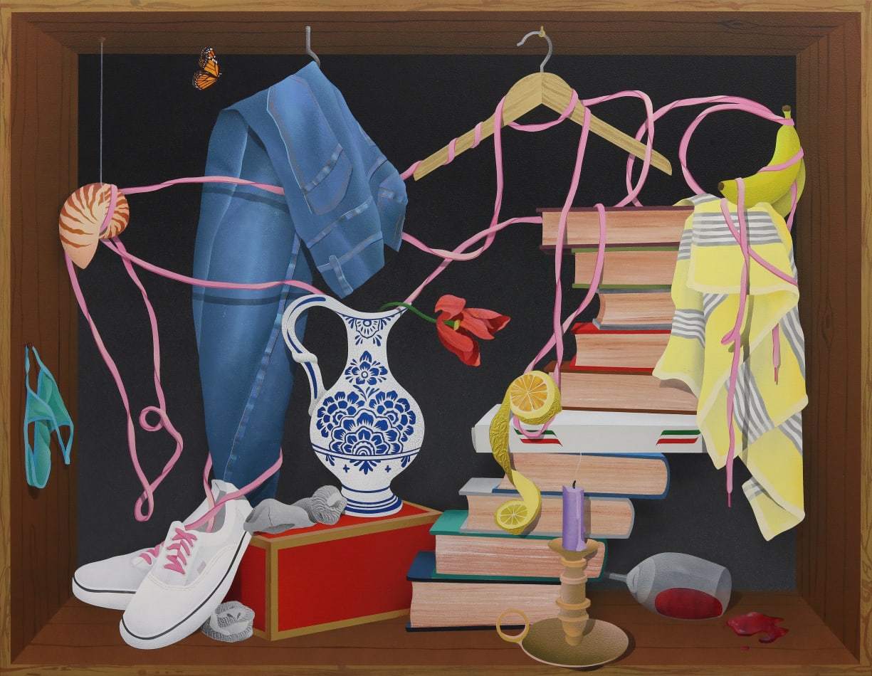 still life with stacked books, shoes, pants and other objects