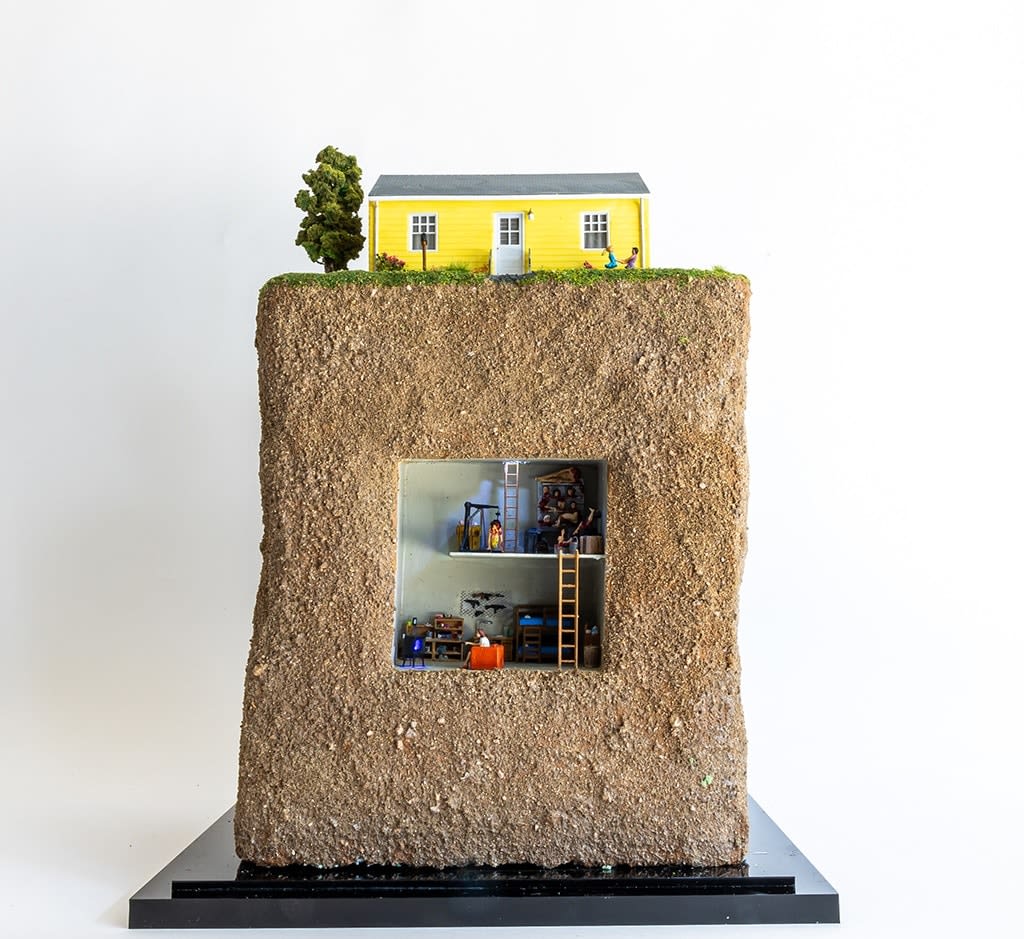miniature diorama by Abigail Goldman of an underground murder bunker beneath a yellow suburban home