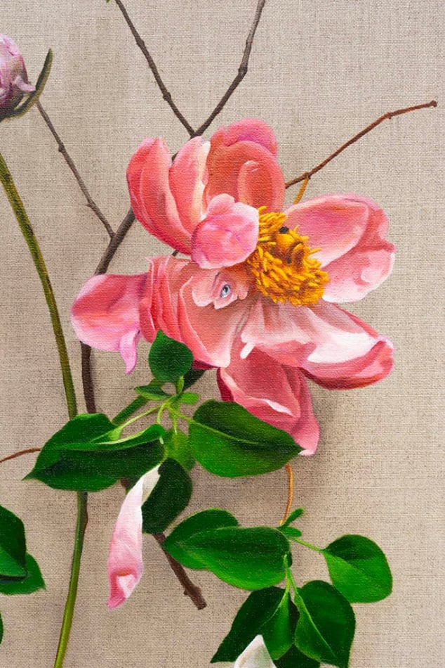 detail of pink flowers with green leaves and stems with subtle dog faces