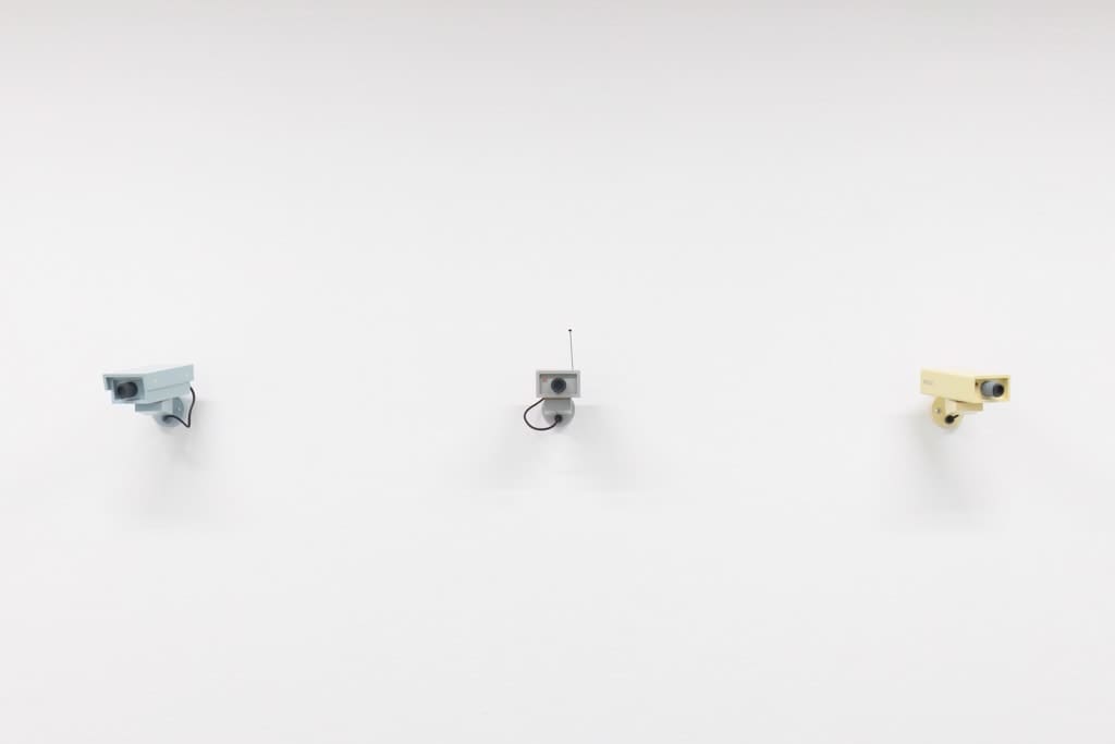 Three sculptures of CCTV cameras by Jeff Canham.