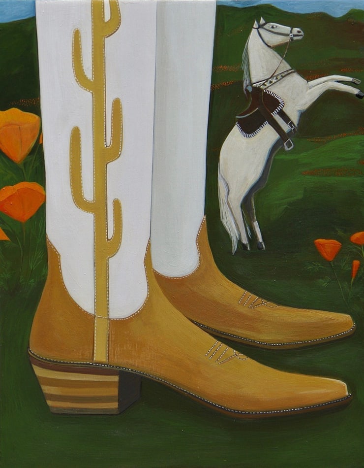 cowboy boots next to a small horse