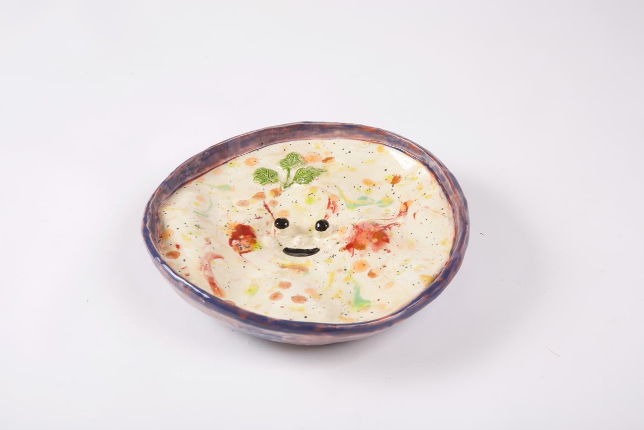 Katie Kimmel ceramic sculpture depicting bowl of potato soup with cartoon eyes