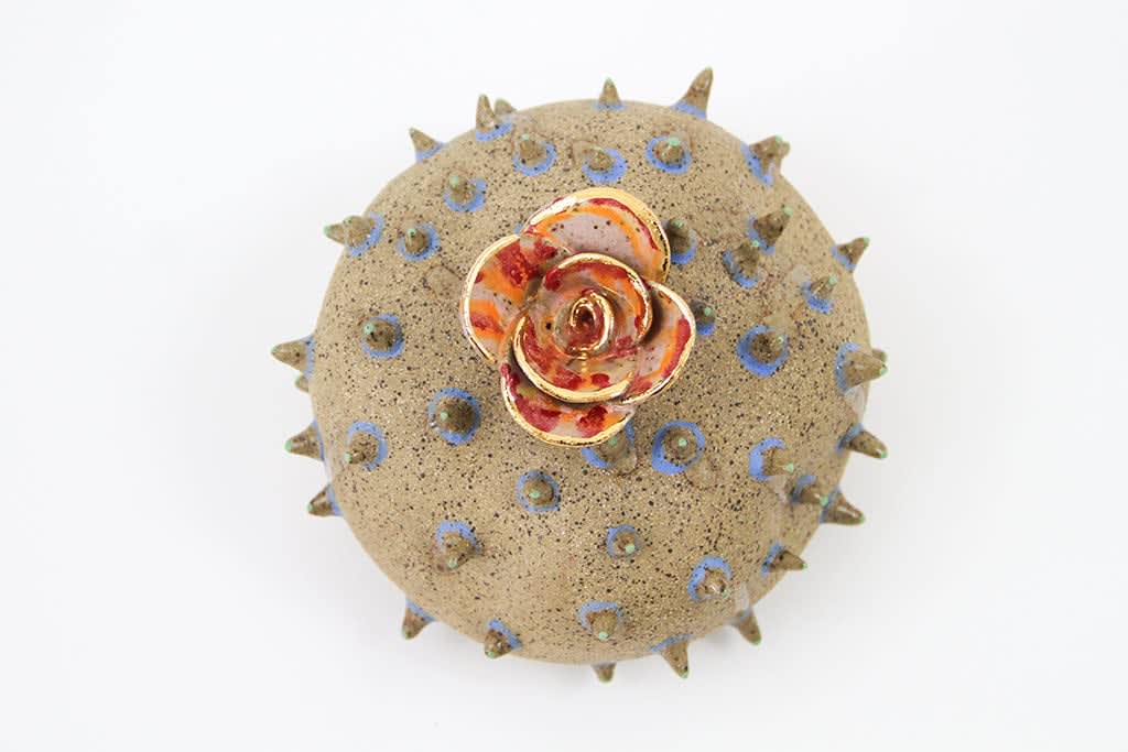 Jen Dwyer sculpture - round brown spiky plant with flower on top
