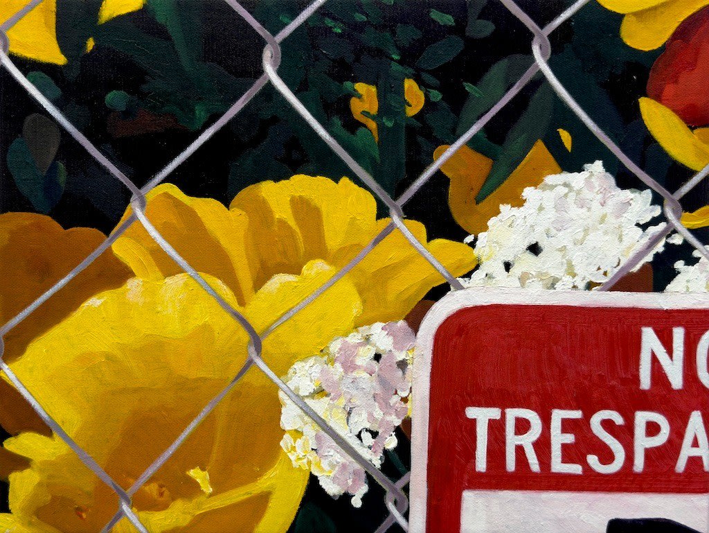 yellow flowers behind a wire fence with a red no trespassing sign in the corner