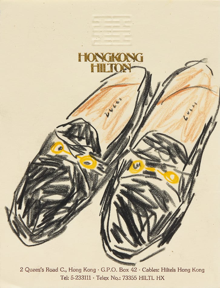 Drawing of black Gucci loafers on hotel stationery