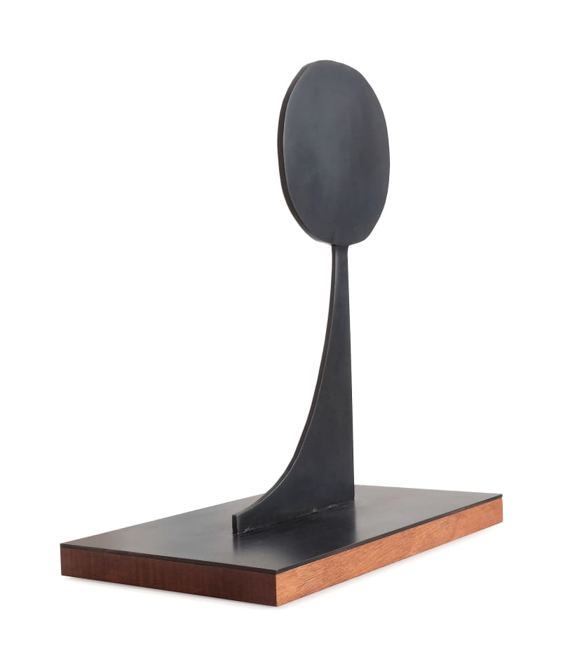 Scott Albrecht steel sculpture of circle balanced on top of angled piece side view