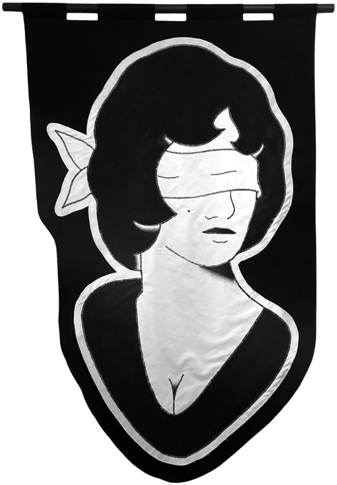 embroidered black and white banner of a blindfolded woman