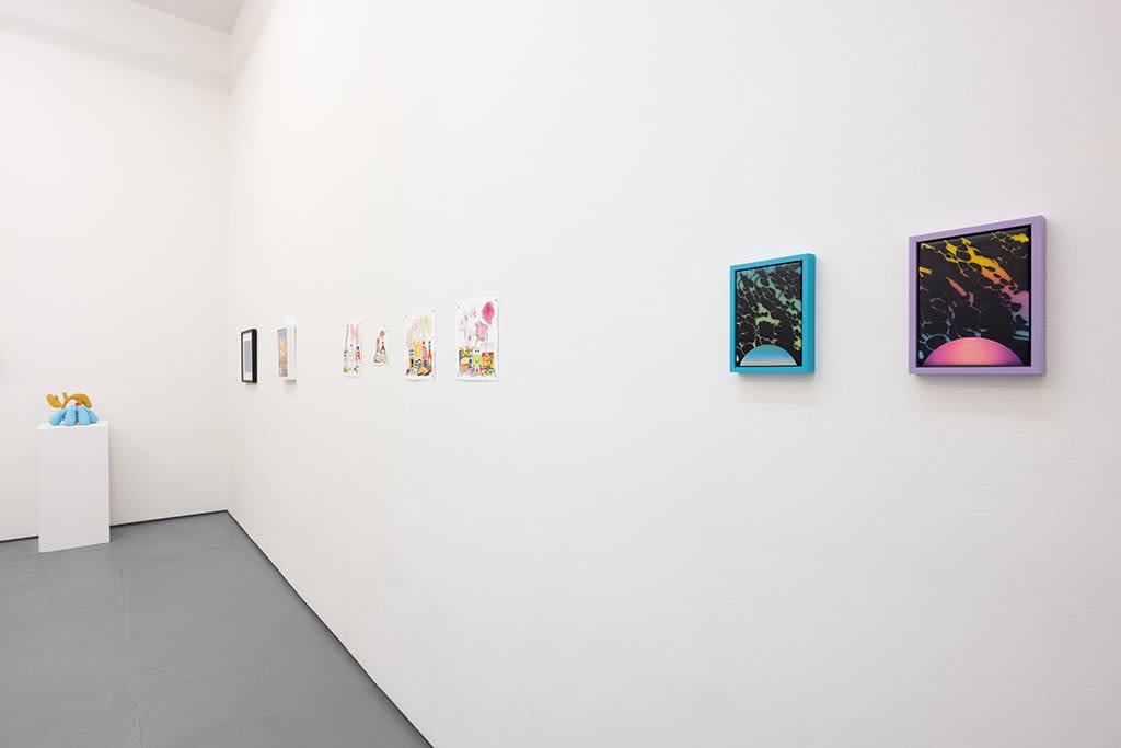 white gallery walls with assorted small artworks