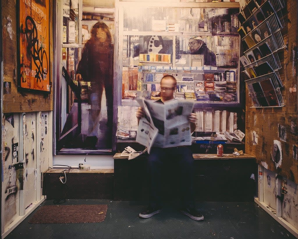 Shaun Roberts photo of male figure reading newspaper
