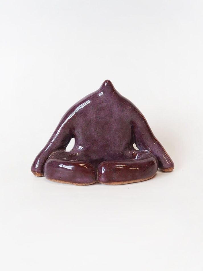 ceramic piece by Jocelyn Tsaih of a purple figure sitting