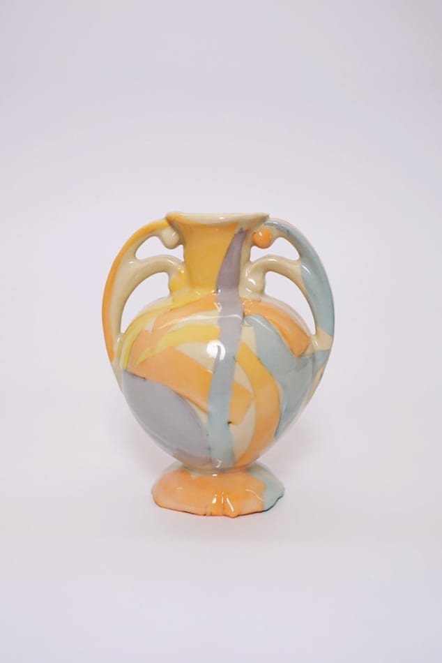H. Bradley's colorful vase with two handles at the top