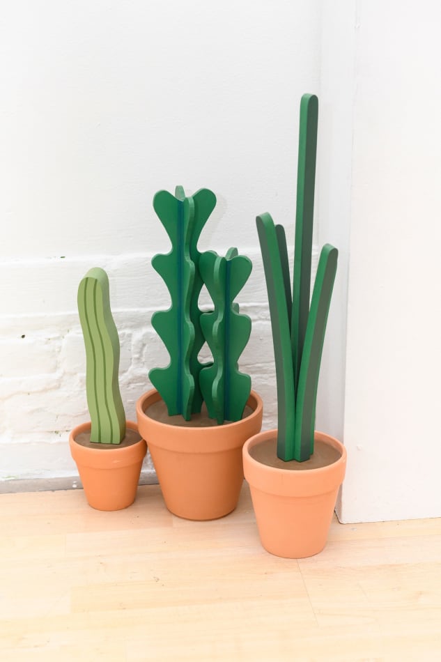 Jeff Canham wooden plant sculpture in a terra cotta pot