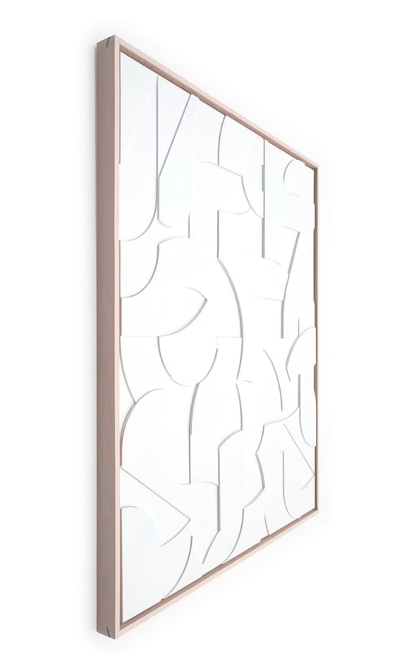 Side view of a framed white wood relief sculptural piece made up of spiral shapes and curves by artist Scott Albrecht