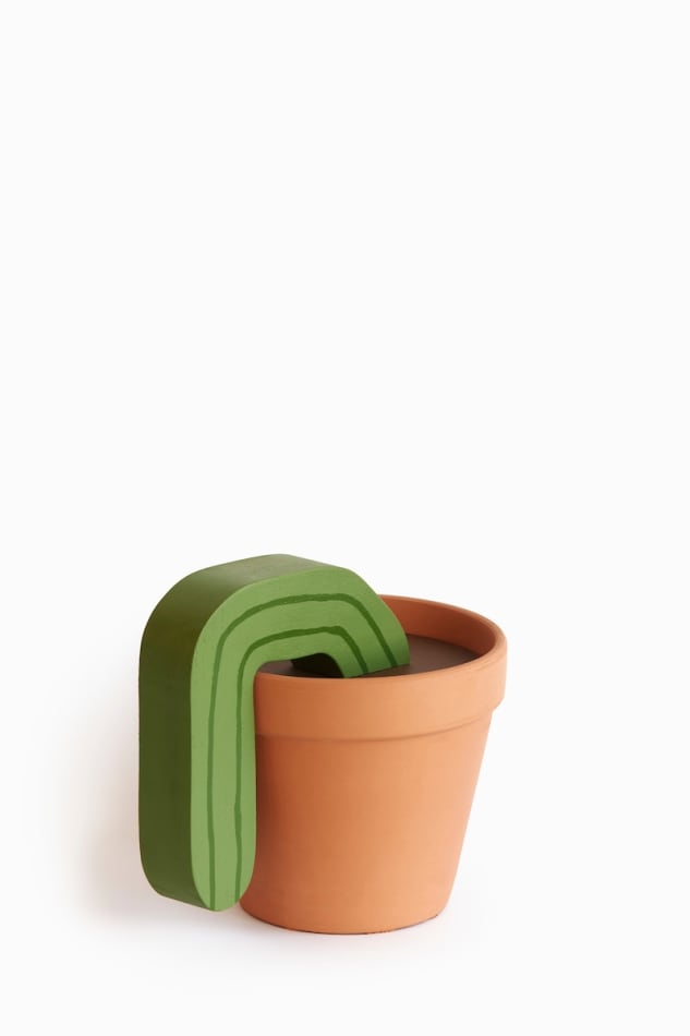 Jeff Canham wooden plant sculpture in a terra cotta pot