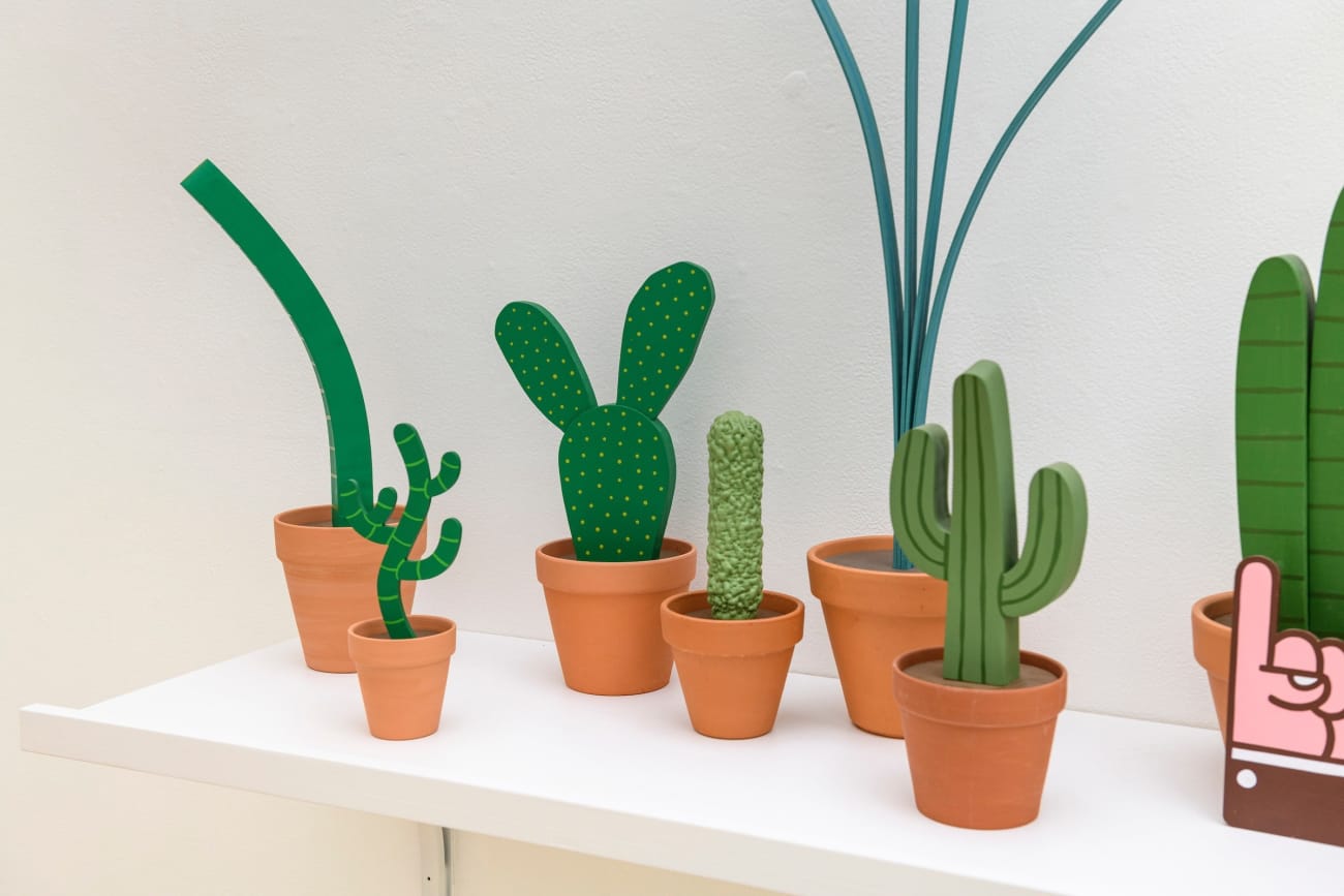 Jeff Canham wooden plant sculptures in a terra cotta pots - In a cluster on a shelf