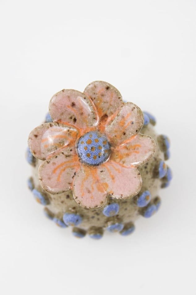 Jen Dwyer sculpture - round tan plant with blue dots all over and pink flower on top