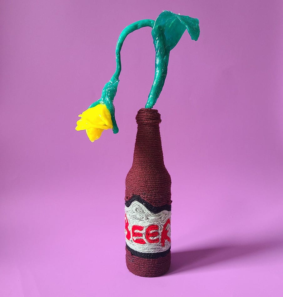 Allison Baker's sculpture of a yellow flower in a beer bottle