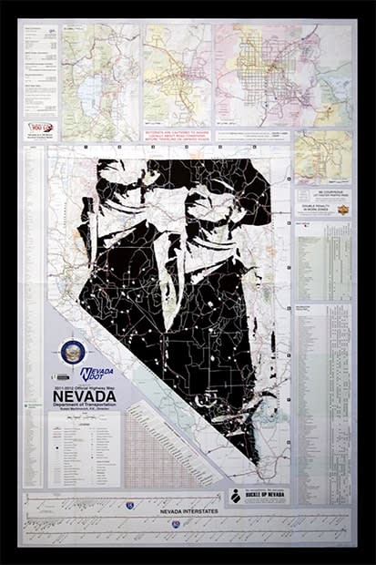 Cut up Nevada paper map with silhouette of two men drawn on it