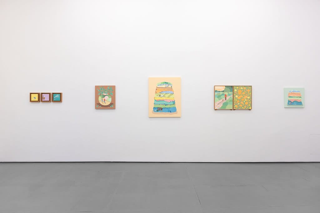 White gallery wall with various paintings by Danym Kwon