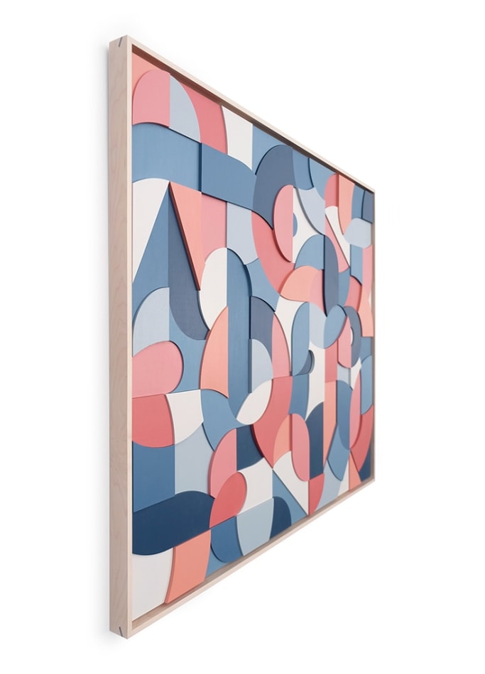 Side view of a framed multicolor wood relief sculptural piece made up of spiral shapes and curves by artist Scott Albrecht