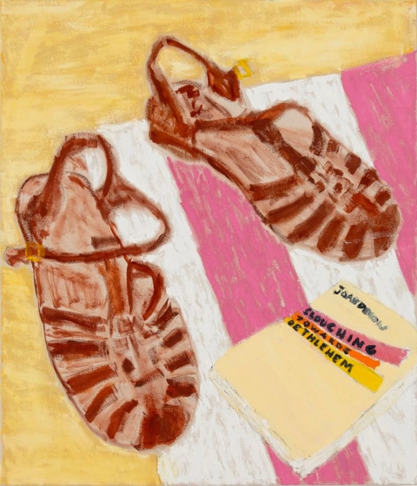 pair of brown leather sandals on a pink and white and next to a joan didion novel
