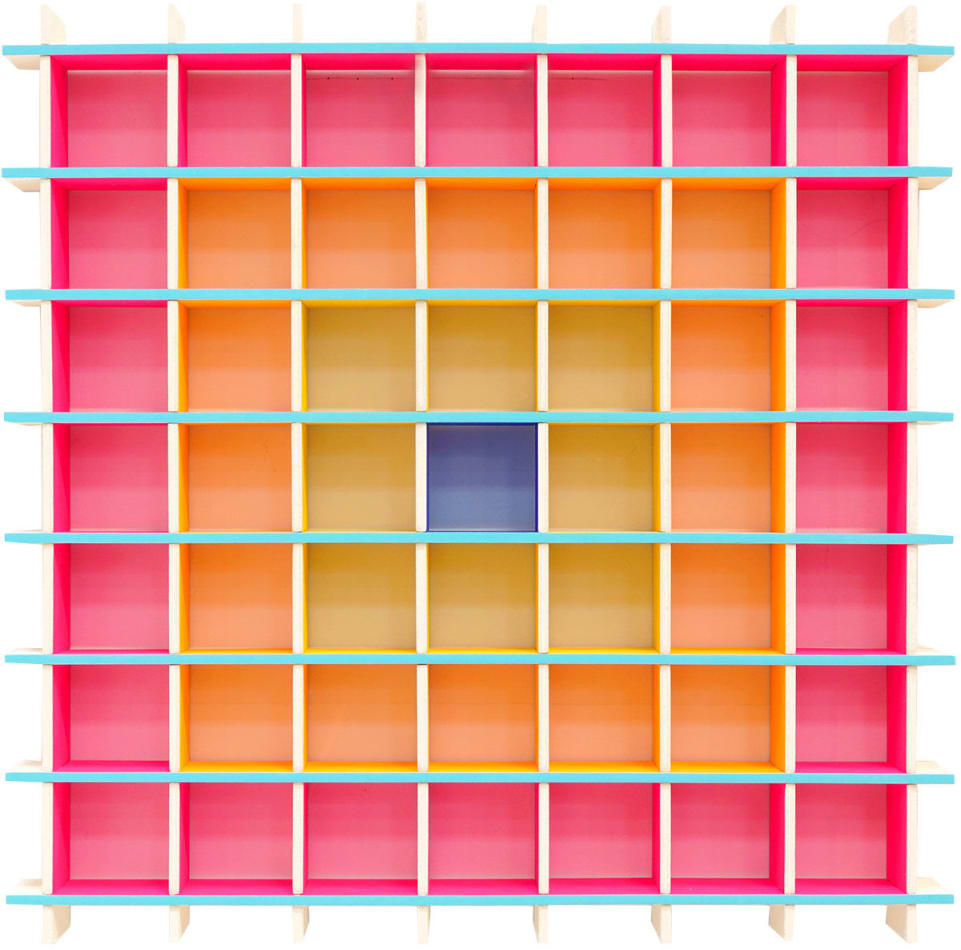 square wooden grid sculpture painted in layers of pink, orange, yellow and blue