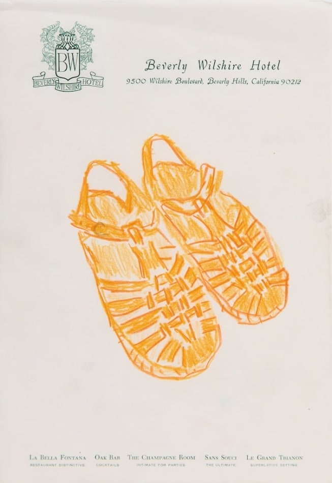 drawing of orange jelly sandals on hotel stationary