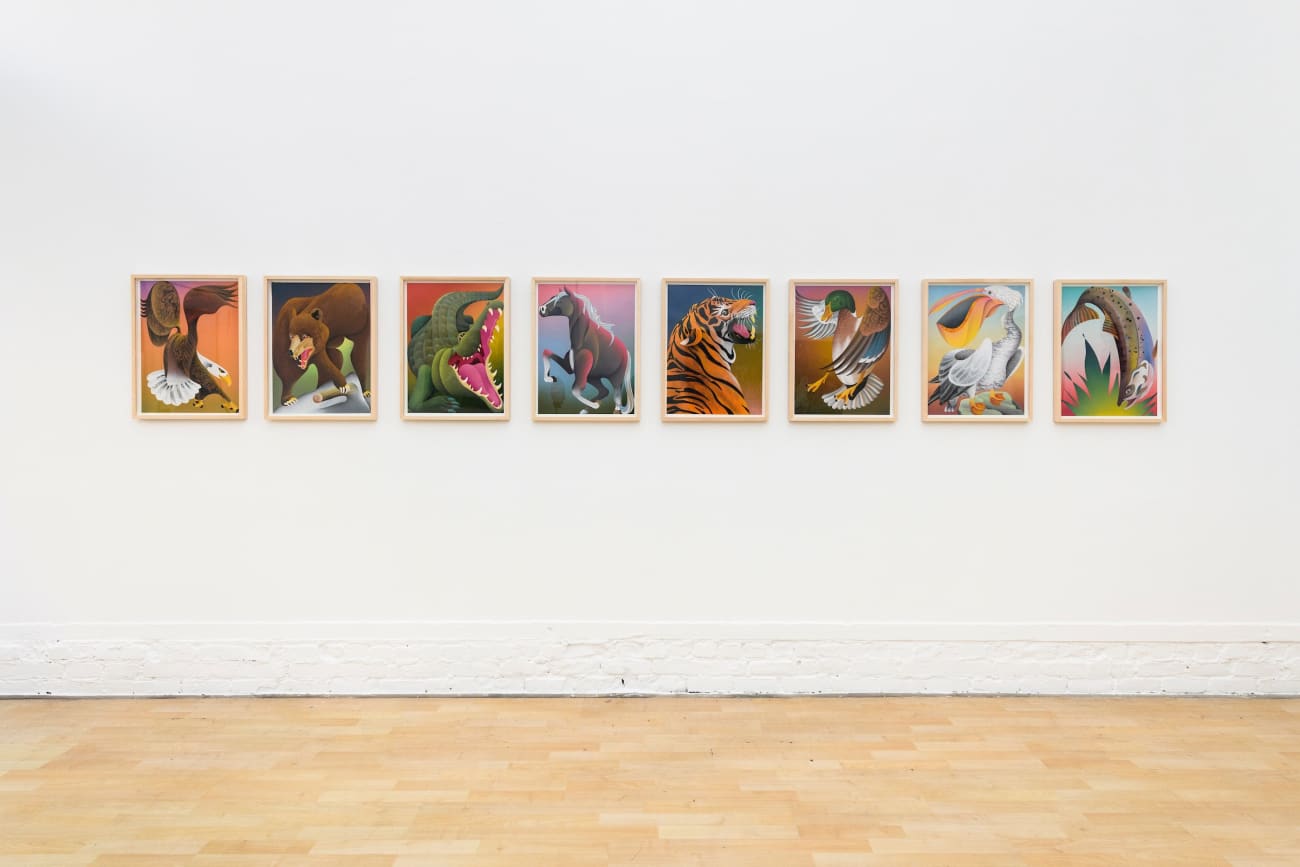 photo of 8 casey gray animal paintings hung on the gallery wall