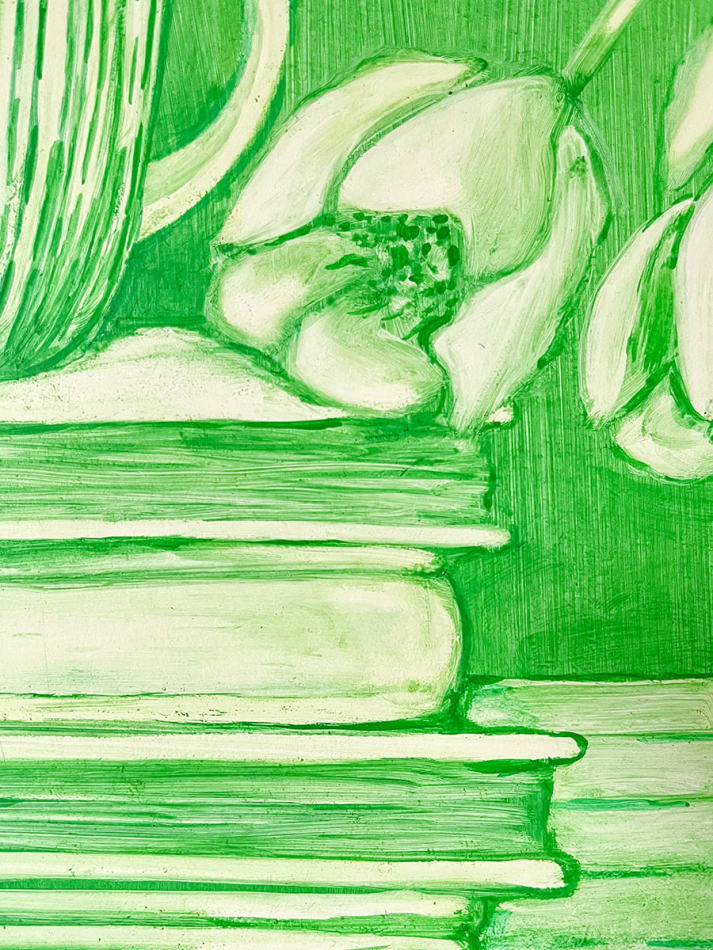 detail of Grace Tobin painting in green tones. Stack of books, coffee mug and flowers partially visible