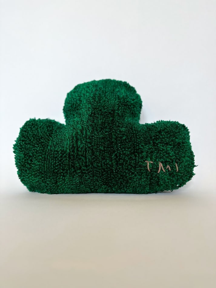sculpture of small leaf, forest green pillow