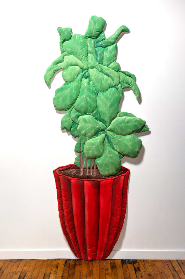 soft sculpture of a tall green plant in a red pot