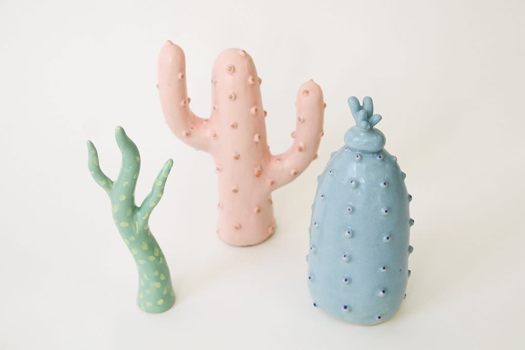 Jen Dwyer porcelain sculptures of stylized pastel cactii (light blue, pale green and light pink)