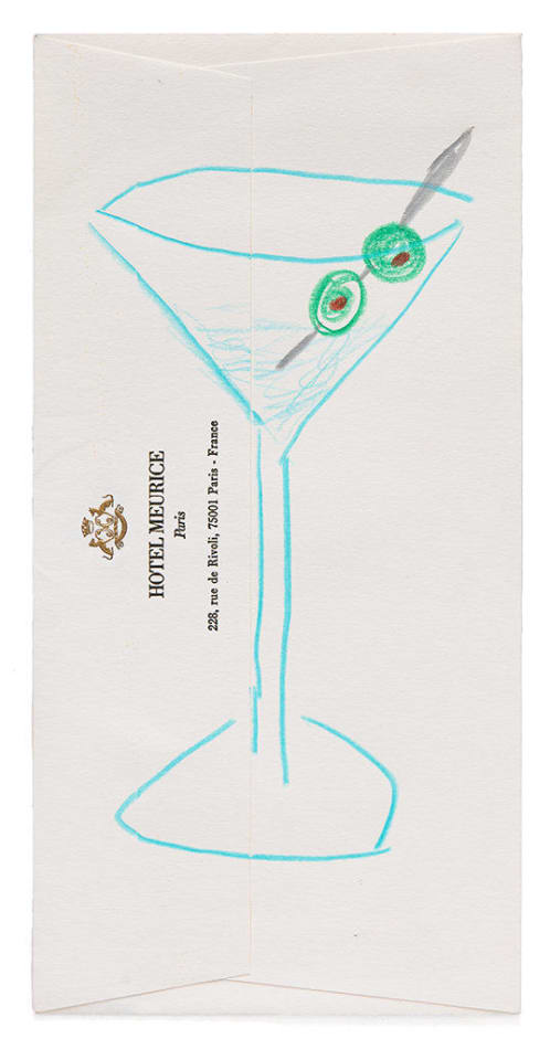 Drawing of a martini with two olives on a pick on an envelope