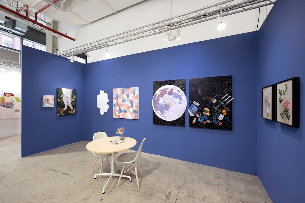 installation view of Hashimoto Contemporary booth at future fair featuring paintings on dark blue walls
