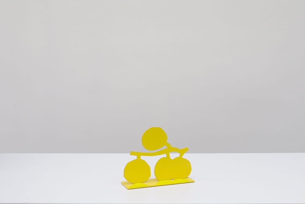 Metal sculpture of four lemons on a vine