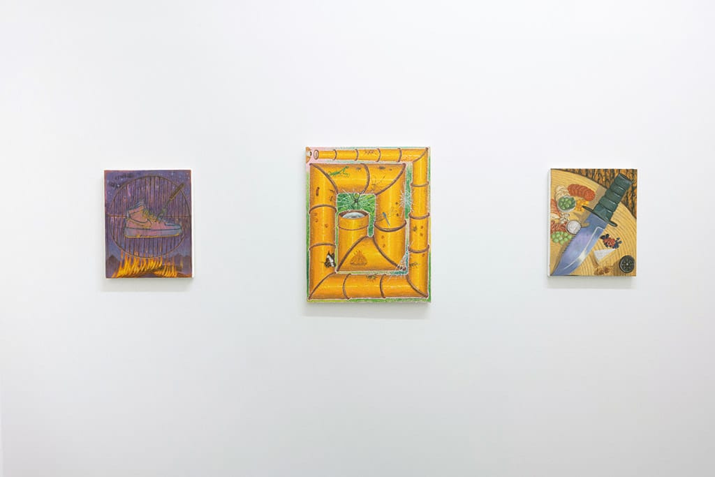 Installation photo of artwork on a white wall next to other paintings
