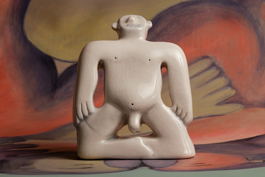 sculpture of a man standing on his knees