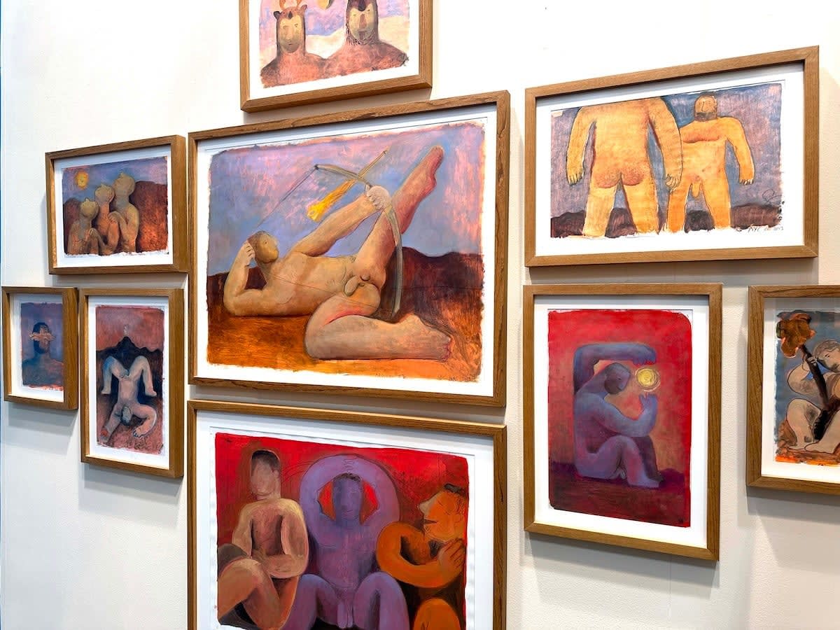 installation view of Carlos Rodriguez framed paintings on paper in a cluster