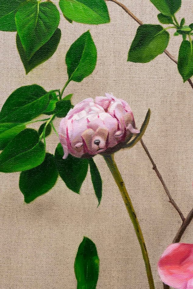 detail of pink flowers with green leaves and stems with subtle dog faces