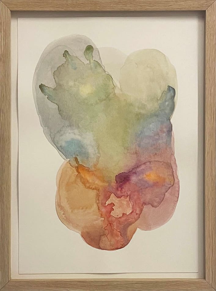 Rainbow colored abstract watercolor painting in wooden frame