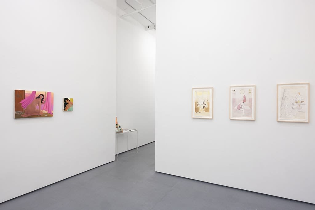 white gallery walls with paintnigs of various sized by Allie Gattor and Natalie Terenzini
